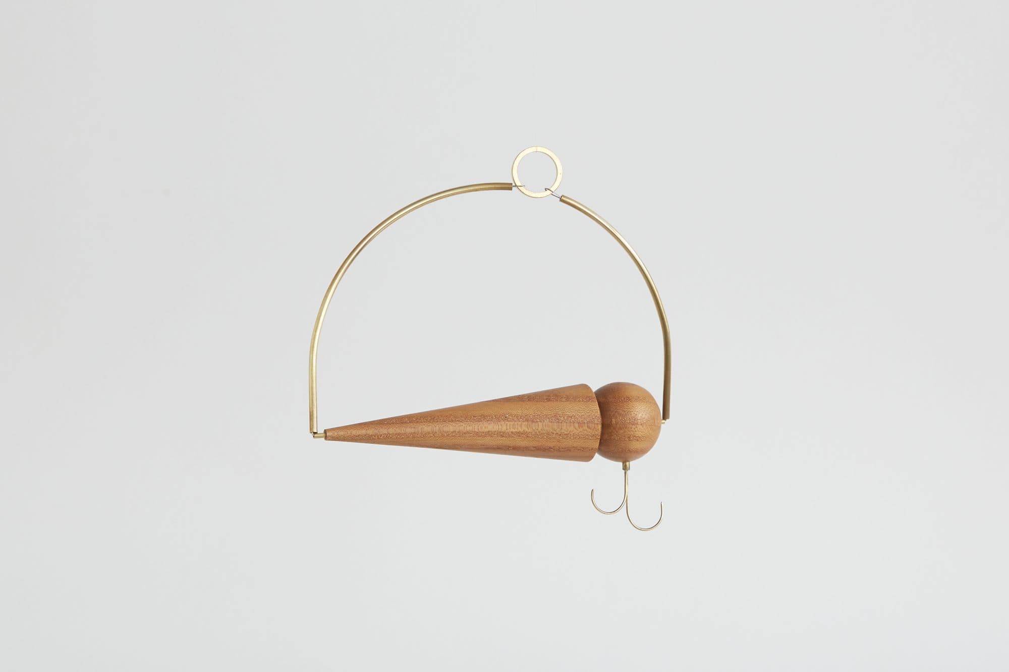 Brass hoop ornament with a turned wood point by 2nd Shift