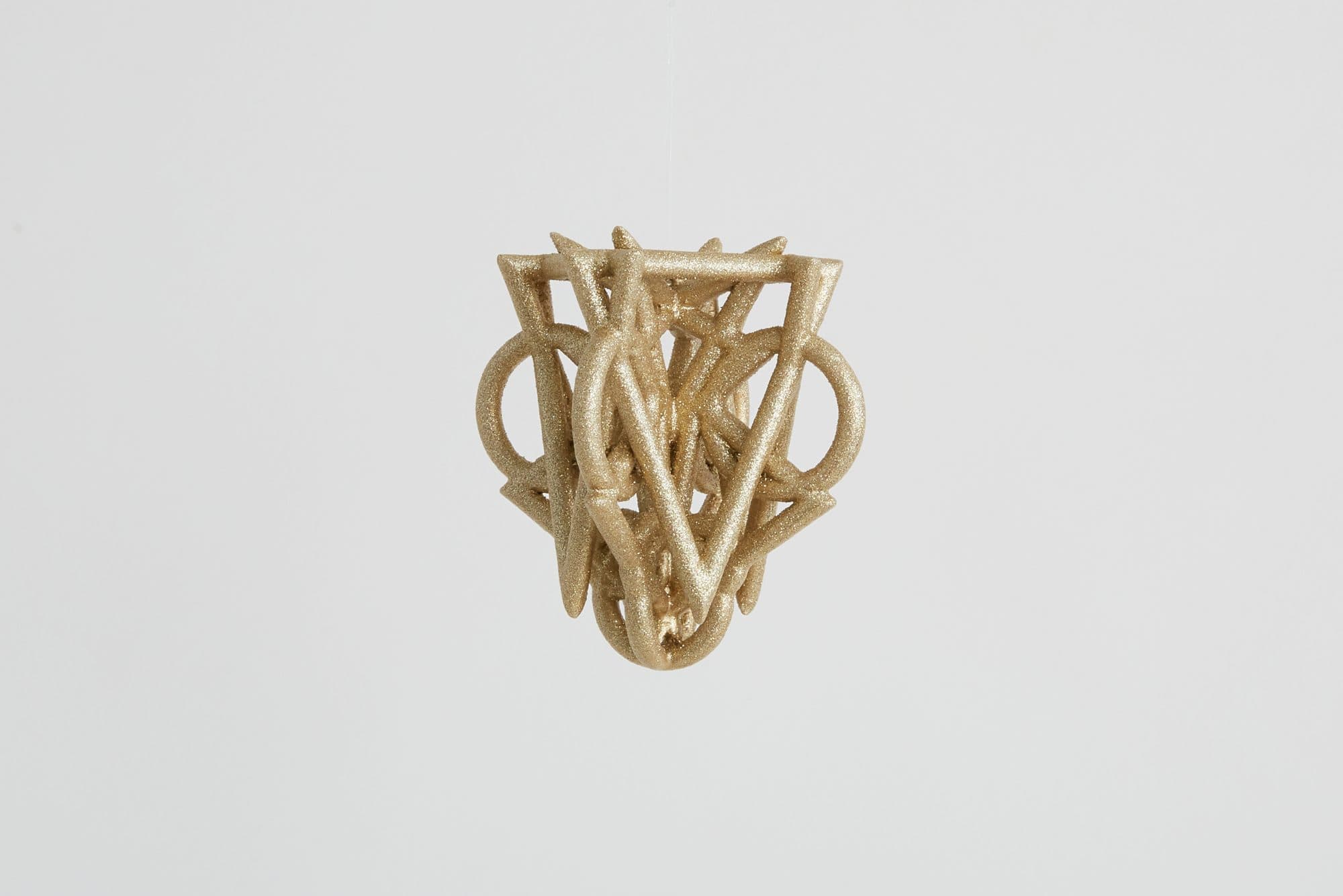Knotted brass ornament by Alex Drew