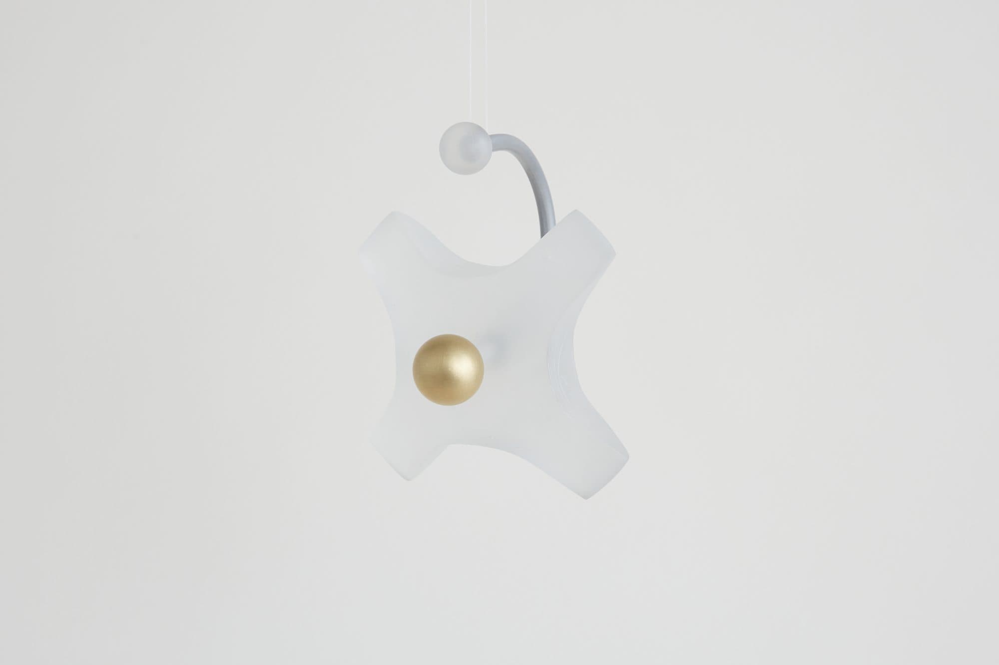White star ornament with a brass sphere by Buoyant