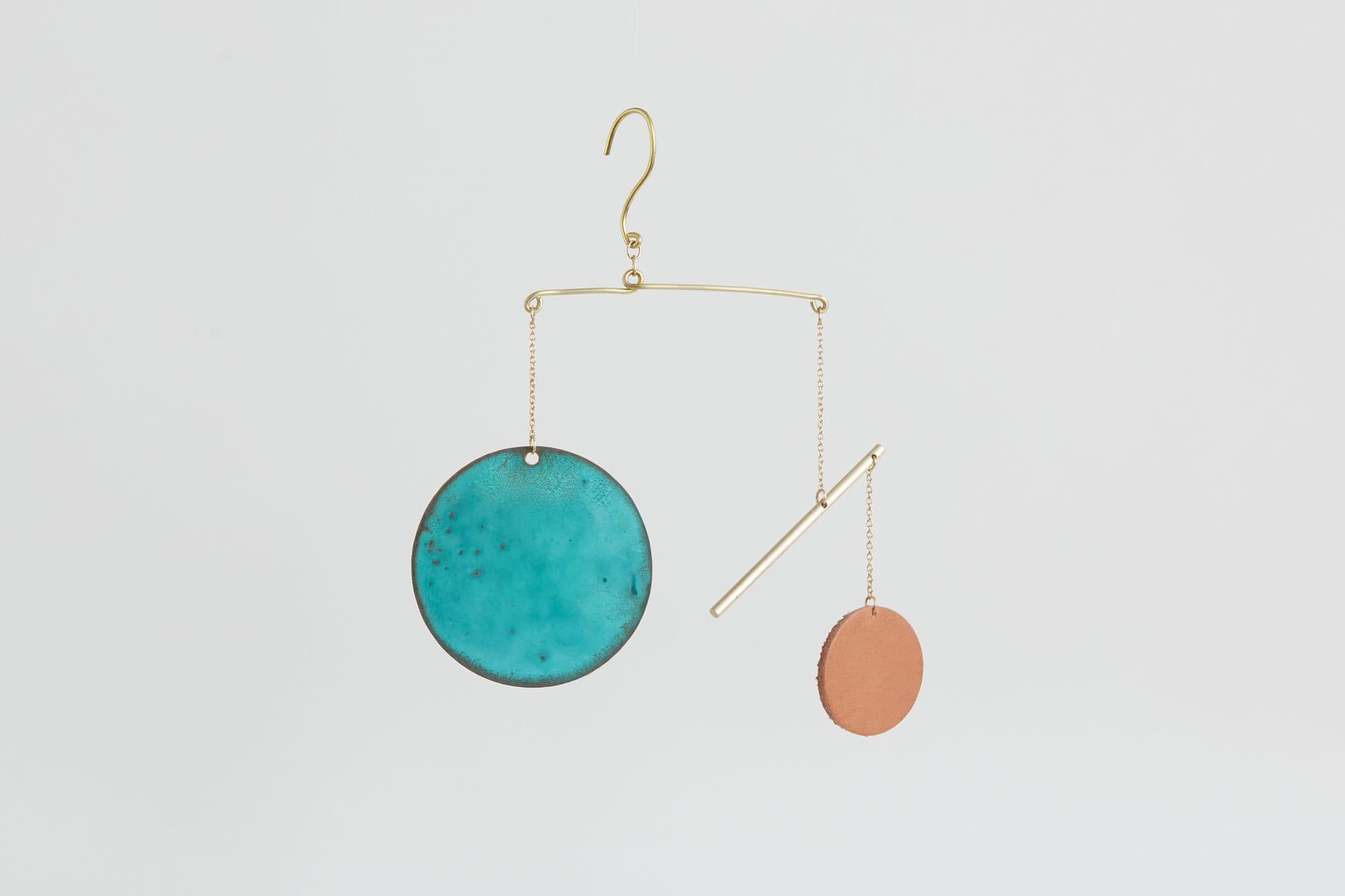 Brass mobile ornament with teal and coral enamel discs by Cofield