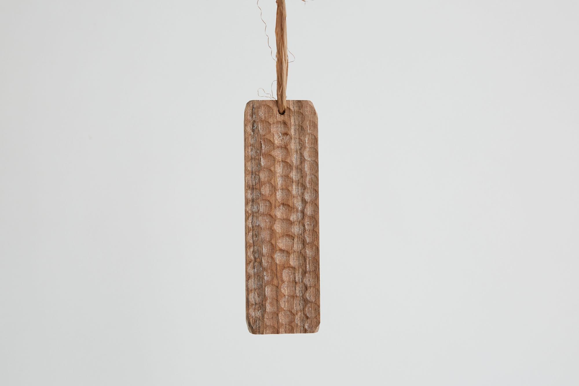 Textured wooden tag ornament by Green River Project