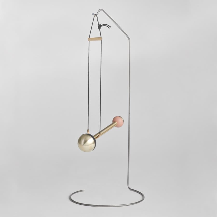 Brass pendulum ornament on a steel stand by Bower