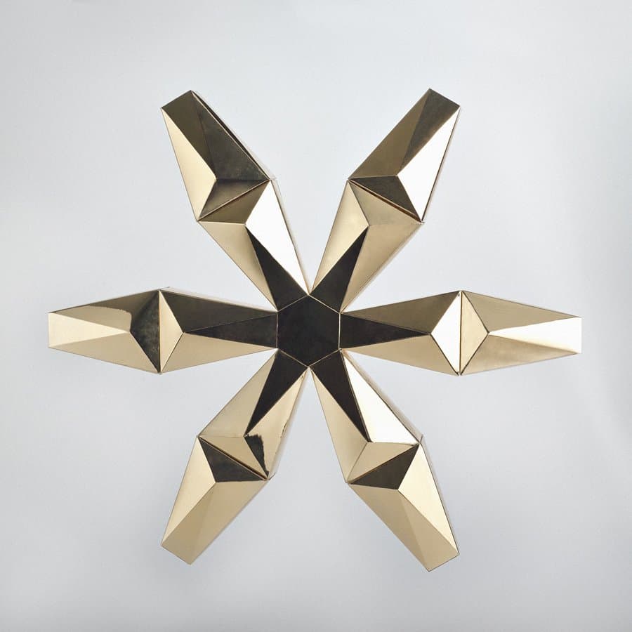 Gold faceted metal star ornament by Egg Collective