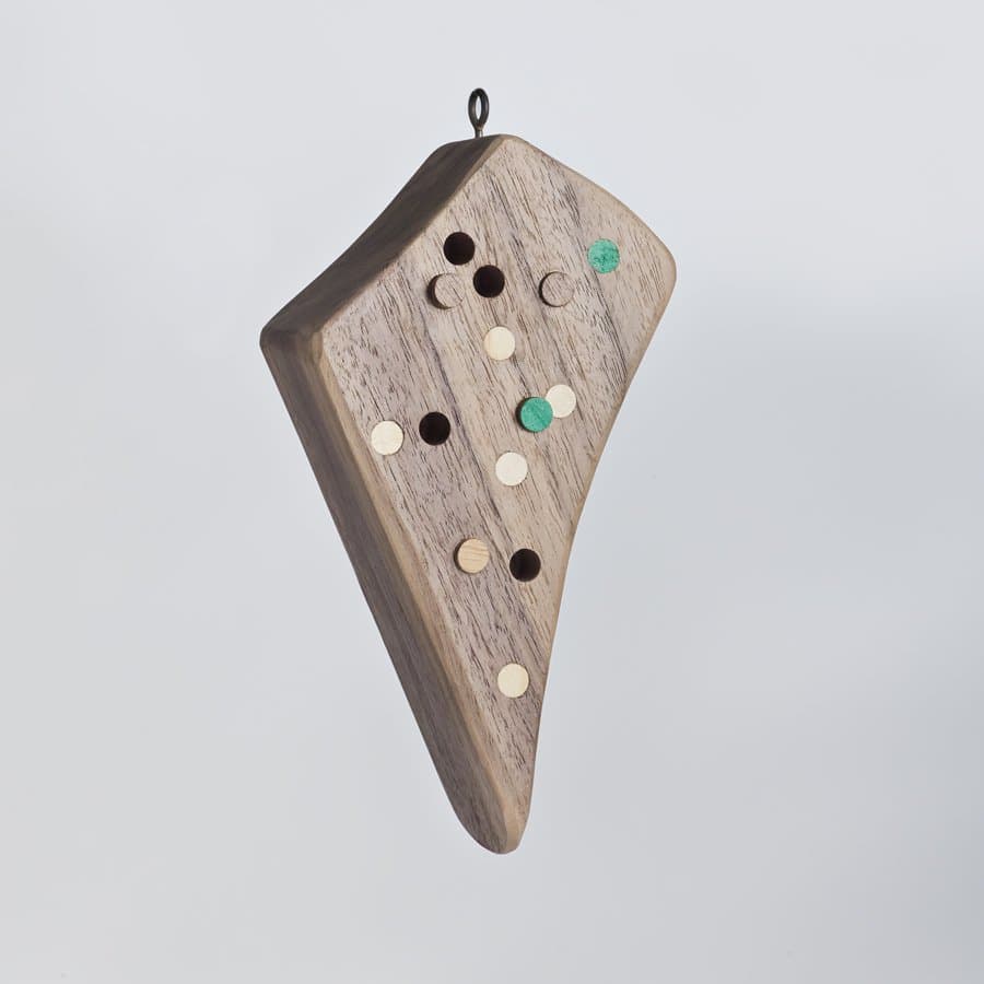 Walnut ornament inlaid with brass dots by Ethan Abramson