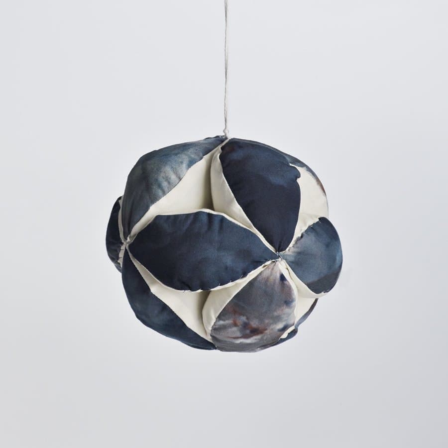 Quilted navy and cream sphere ornament by Haptic Lab