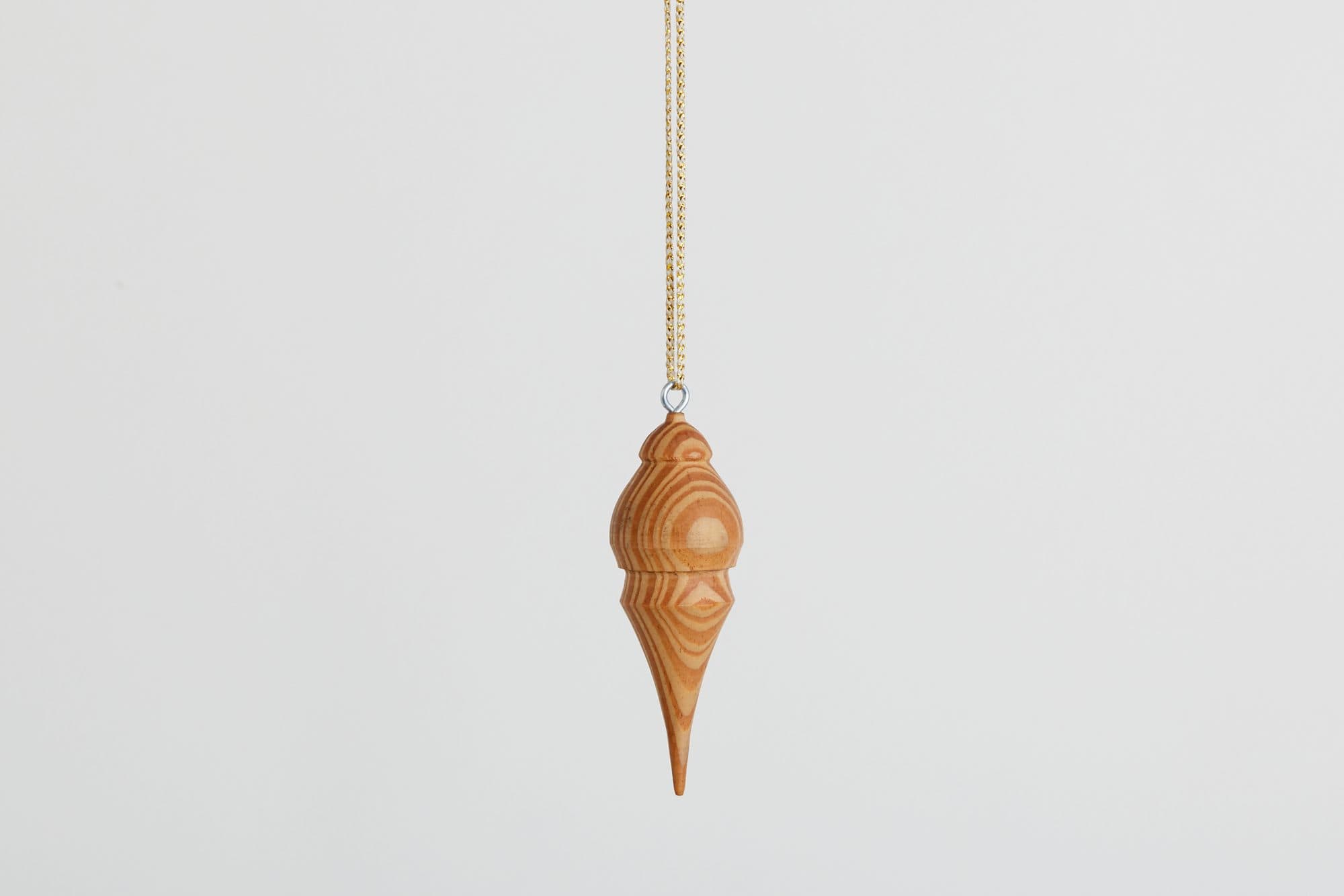 Carved wooden finial ornament by Uhuru