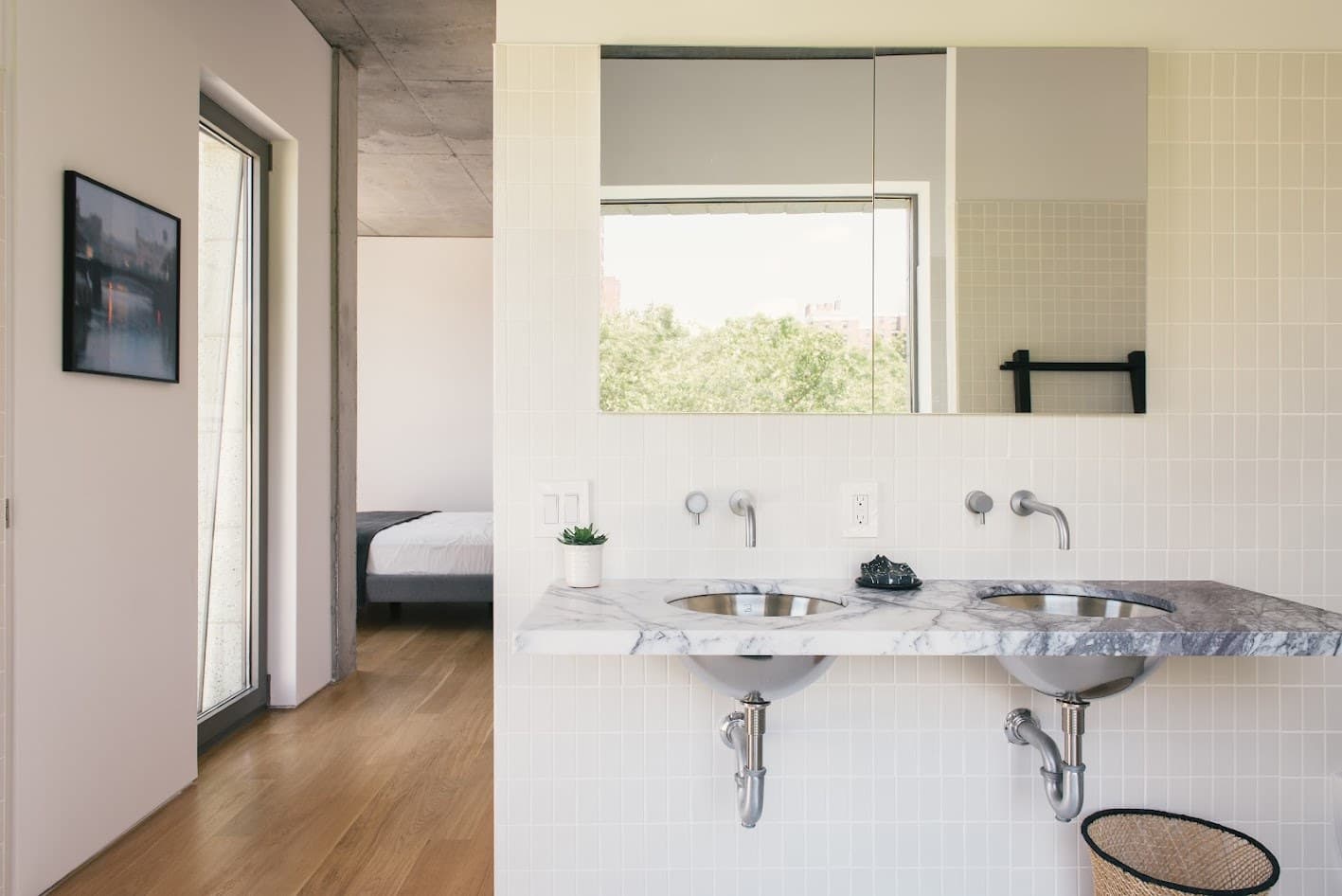 Double marble vanity with wall-mounted faucets