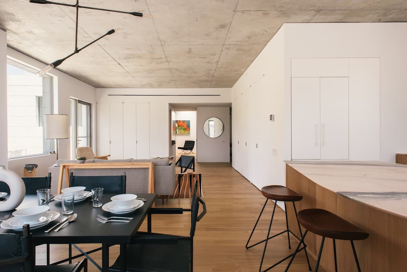Dining area and kitchen island with wood stools