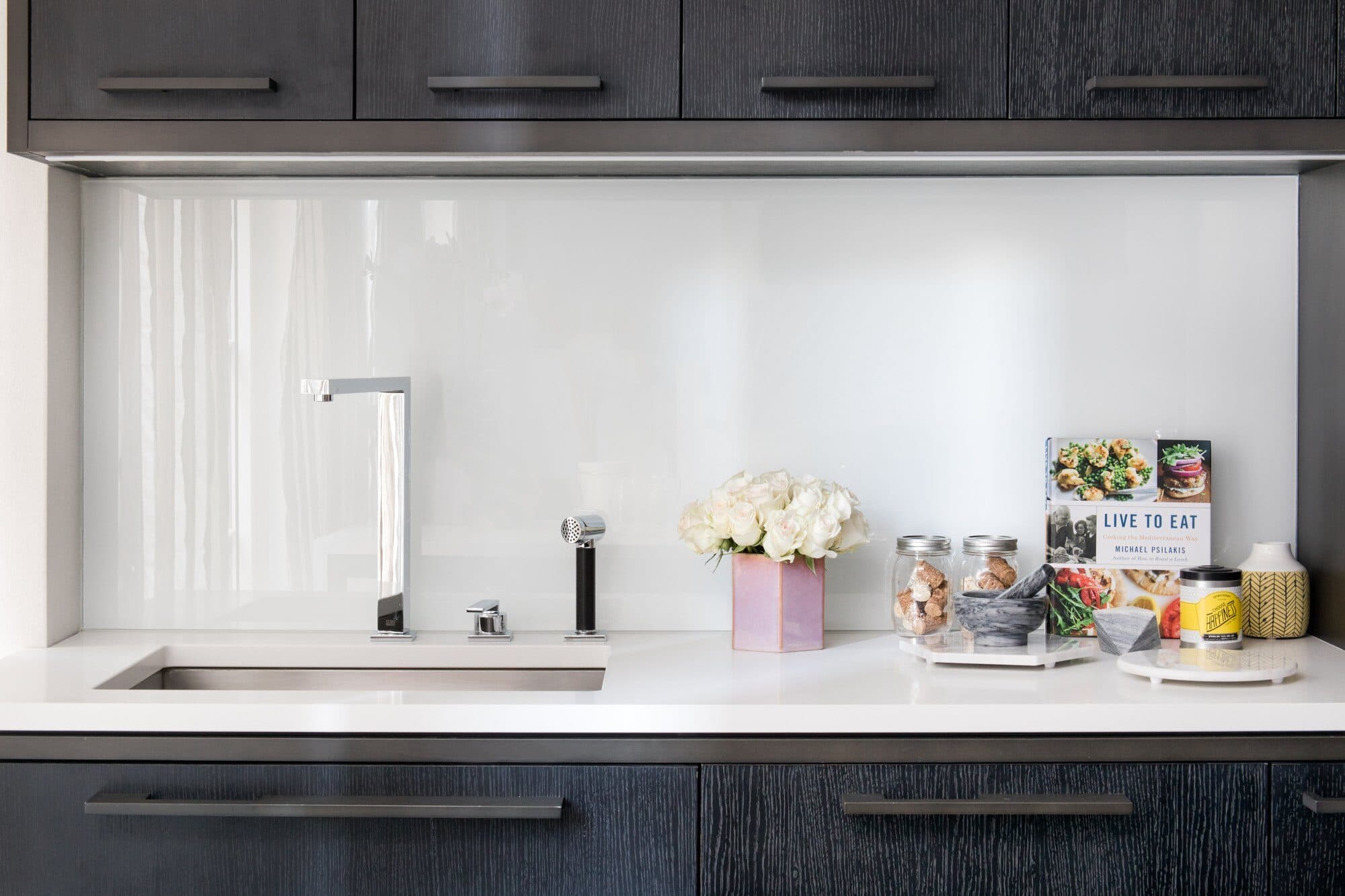 70 Charlton model kitchen counter styled with flowers and glass canisters