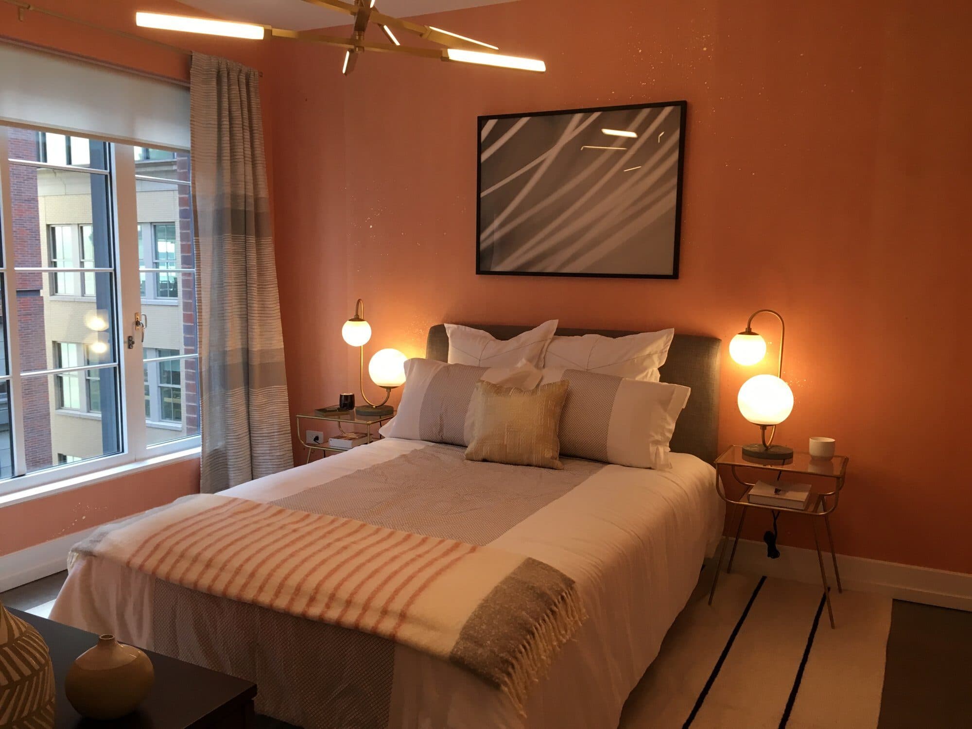 Coral bedroom at dusk with lamps on at 70 Charlton