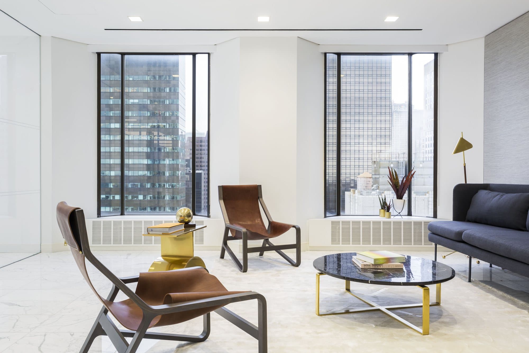 Lounge with leather armchairs and a marble table