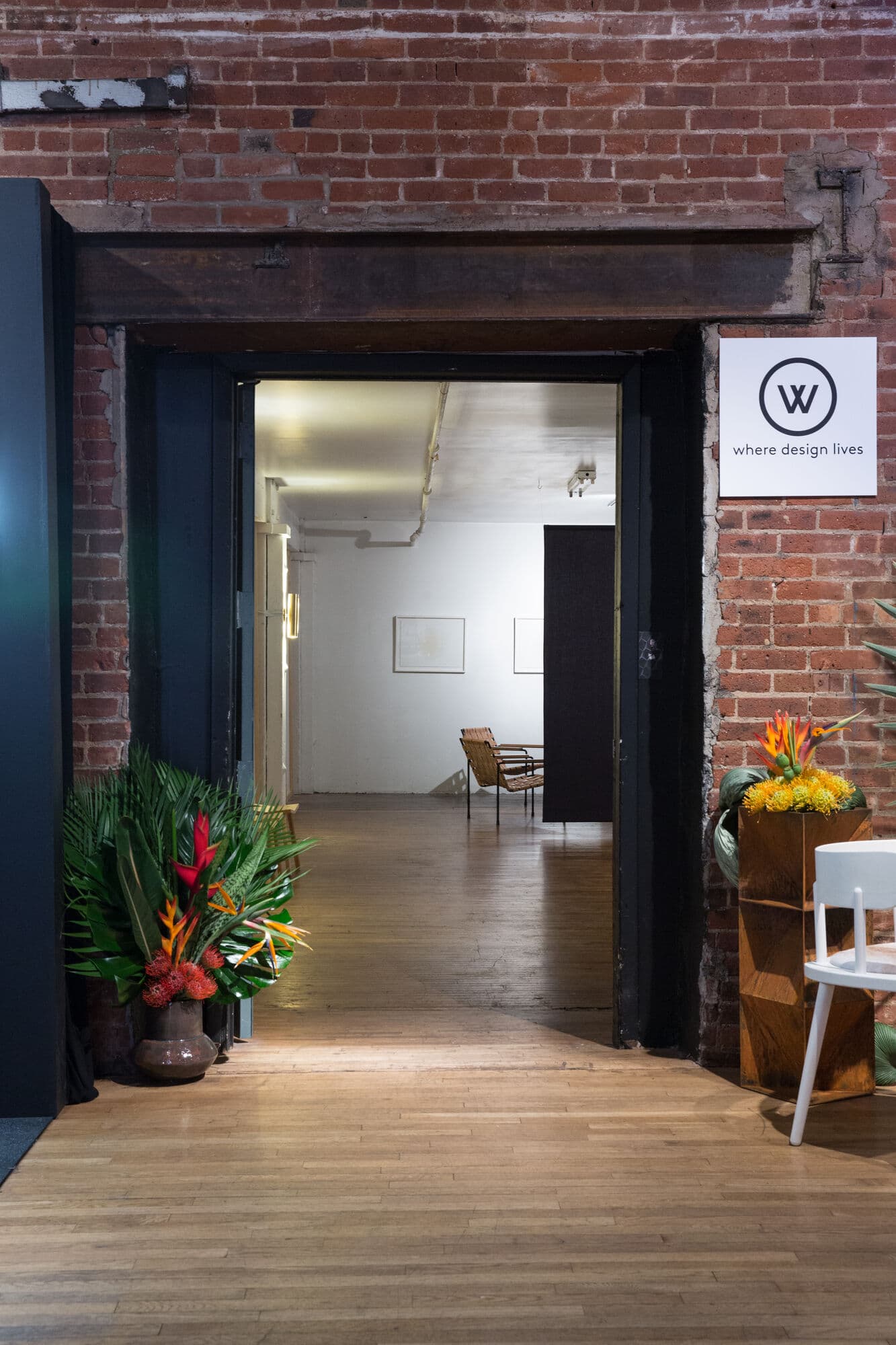 Entrance to the apartment with a WorkOf sign on brick