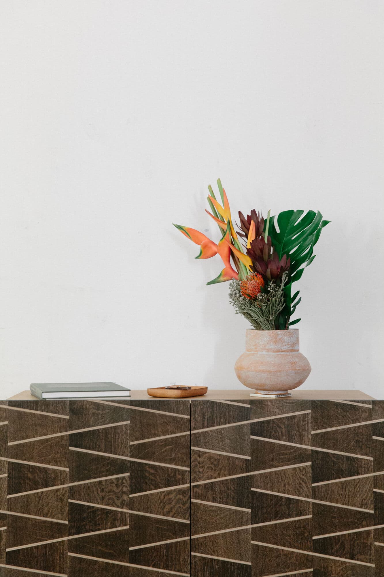 Marquetry credenza with tropical flowers in the Shinola apartment at WantedDesign