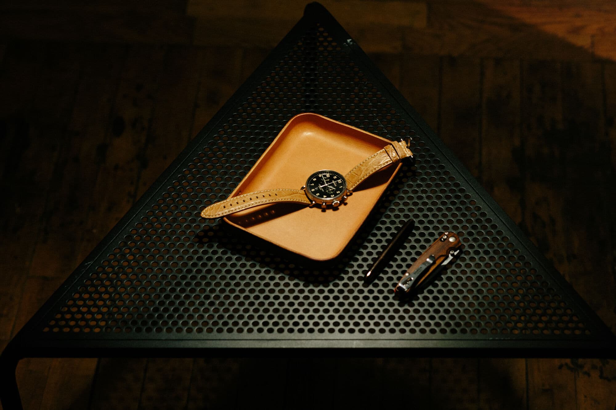 Shinola watch on a perforated steel table