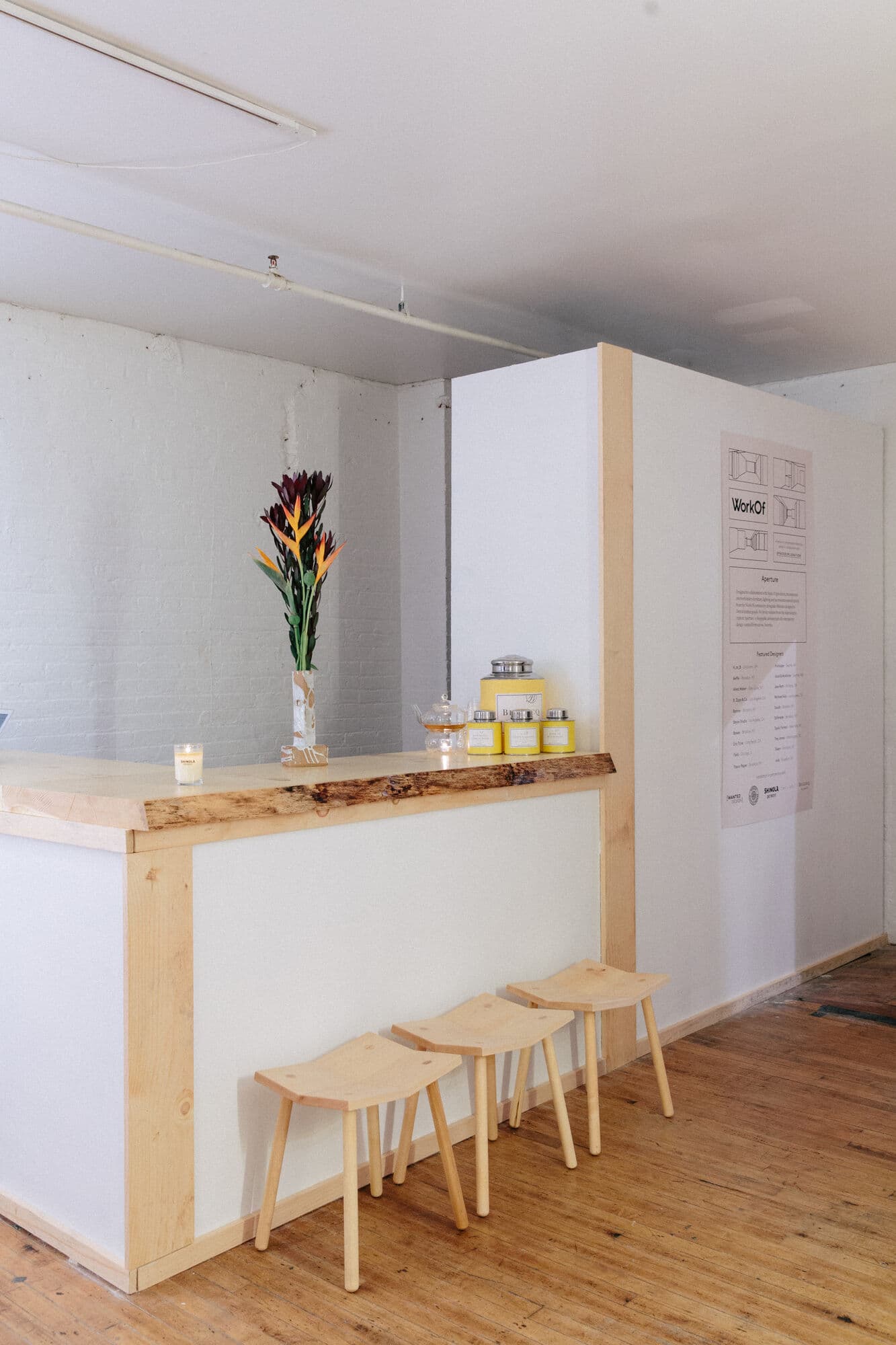Bar counter with wood stools in the Shinola apartment